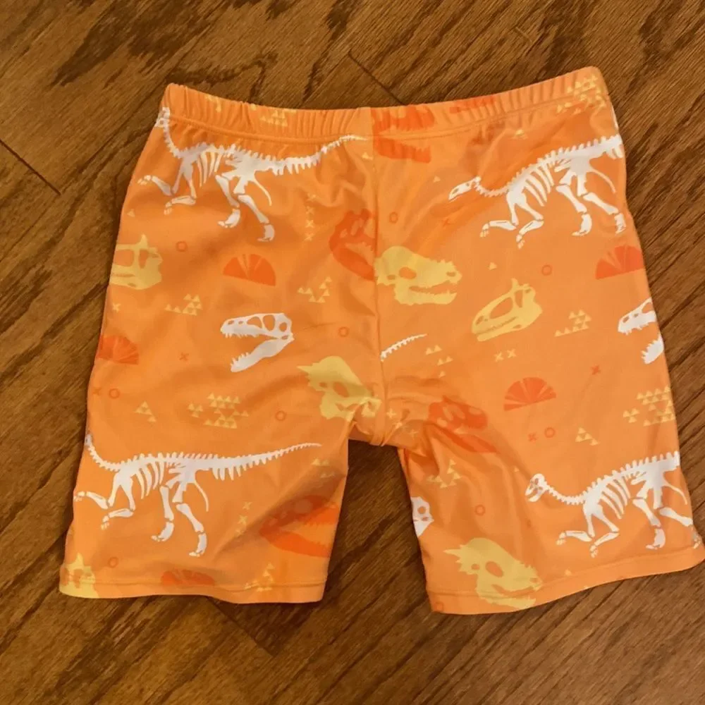 NWOT boys or girls swim shorts size 152 which is an 11/12 - dinosaurs, orange